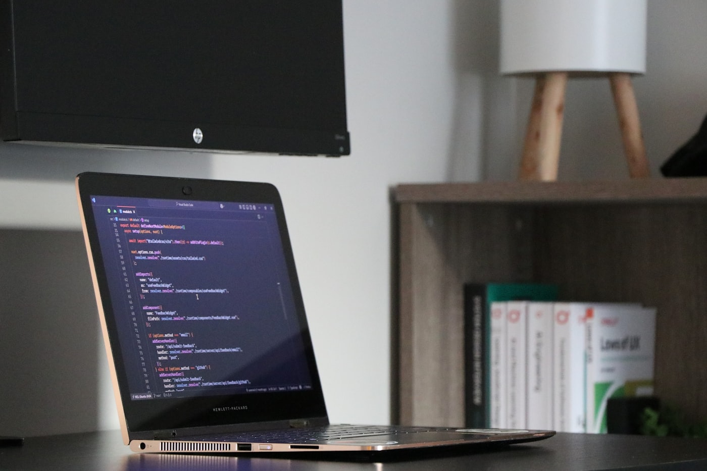 Laptop showing code on a desk for a creator tools and accessibility article